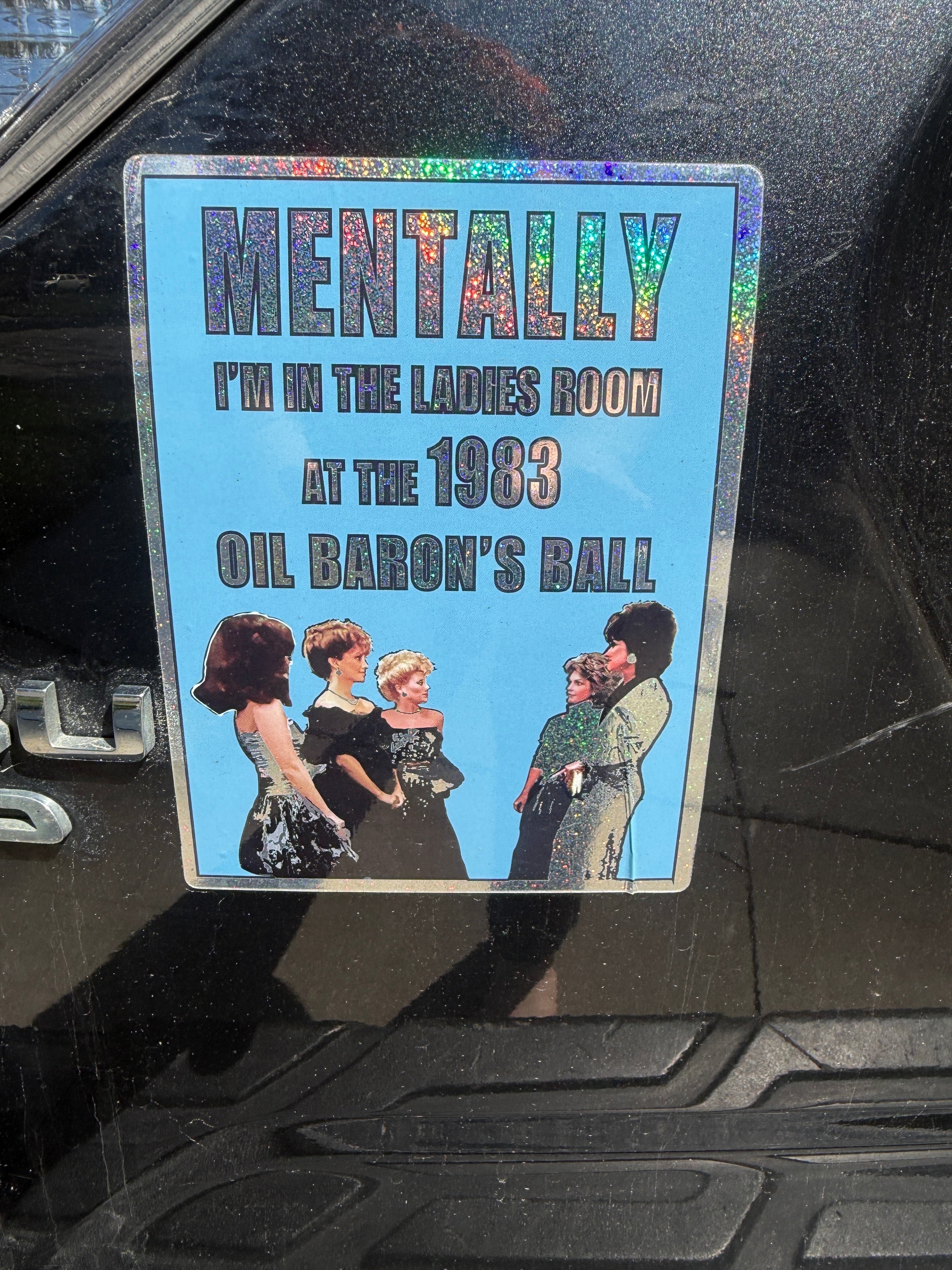 80s DALLAS themed sticker: "MENTALLY IN THE LADIES ROOM AT THE 1983 OIL BARON'S BALL"